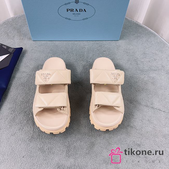 Prada Logo Plaque Quilted Slides In Beige - 1