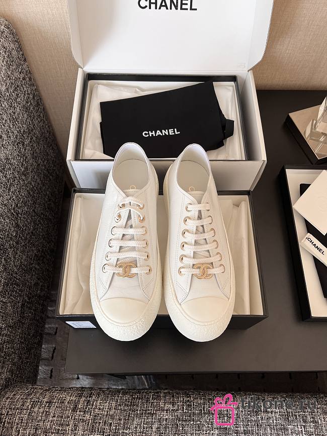 Chanel White Calfskin Sneakers with Gold CC Logo - 1