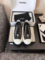 Chanel Black Calfskin Sneakers with Gold CC Logo - 1