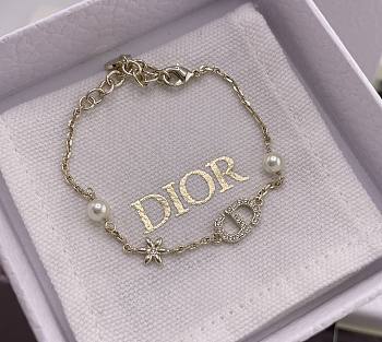 Dior Petit CD Daisy Bracelet Pale Gold Finish Metal White Resin Pearls and Silver Tone Crystals